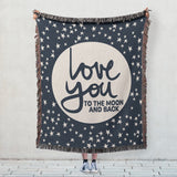 Love you to the Moon and Back phrase on soft navy and natural white woven cotton blanket