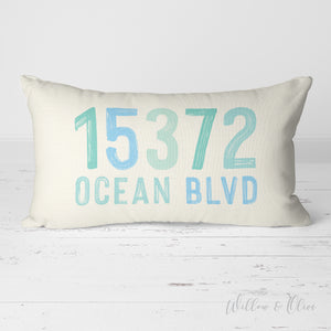 Multi colored coastal blue colors adorn this house address and street name pillow. Available in multiple background colors. Made in the USA