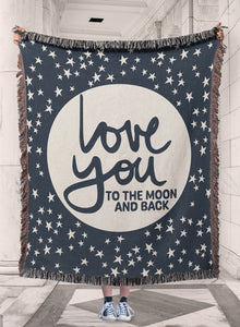 Love you to the Moon and Back phrase on soft navy blue and natural white stars and moon celestial woven cotton blanket